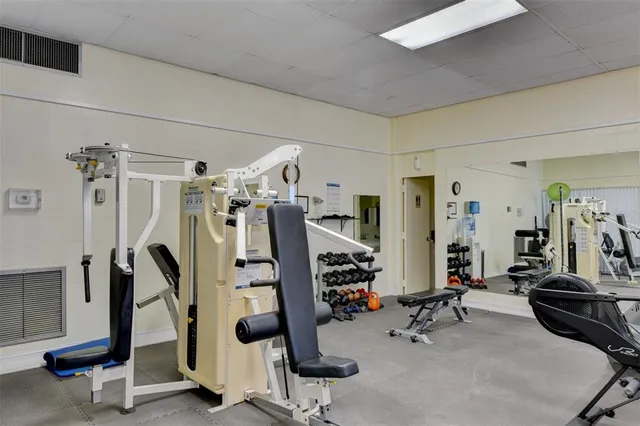 a view of a hallway with paintings on the wall
