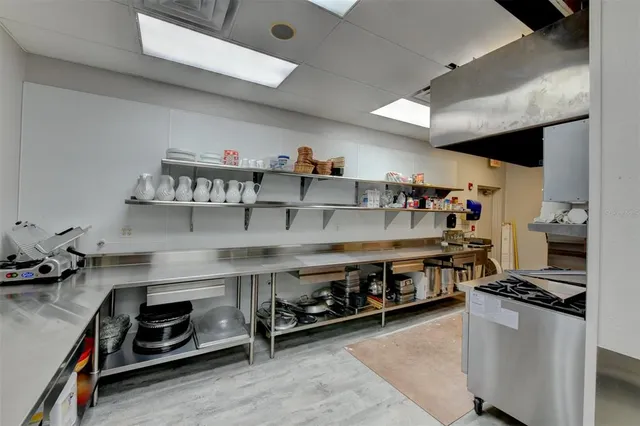 a kitchen with a table and chairs in it