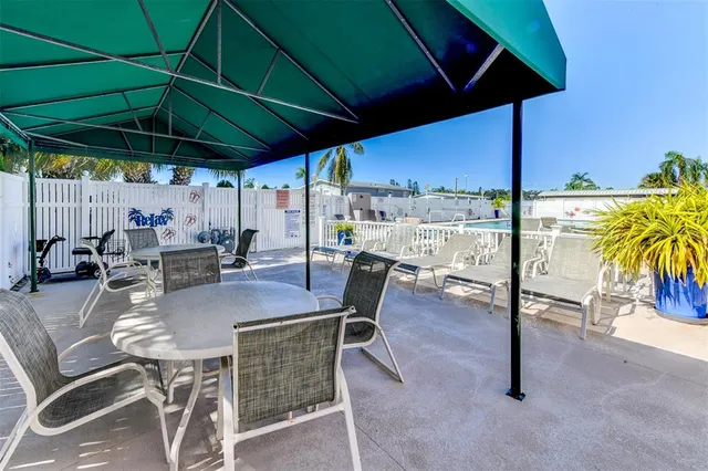 a view of a swimming pool with a yard