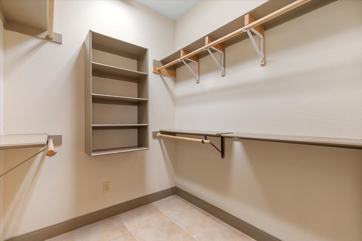 106 Spring Meadow Road Bastrop, TX 78602 - Photo 23 of 39 Spacious closet featuring light tile patterned floors