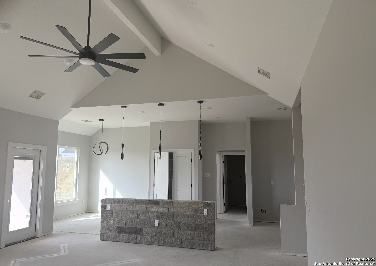 133 Merion Lane La Vernia, TX 78121 - Photo 16 of 18 a living room with a ceiling fan and a window