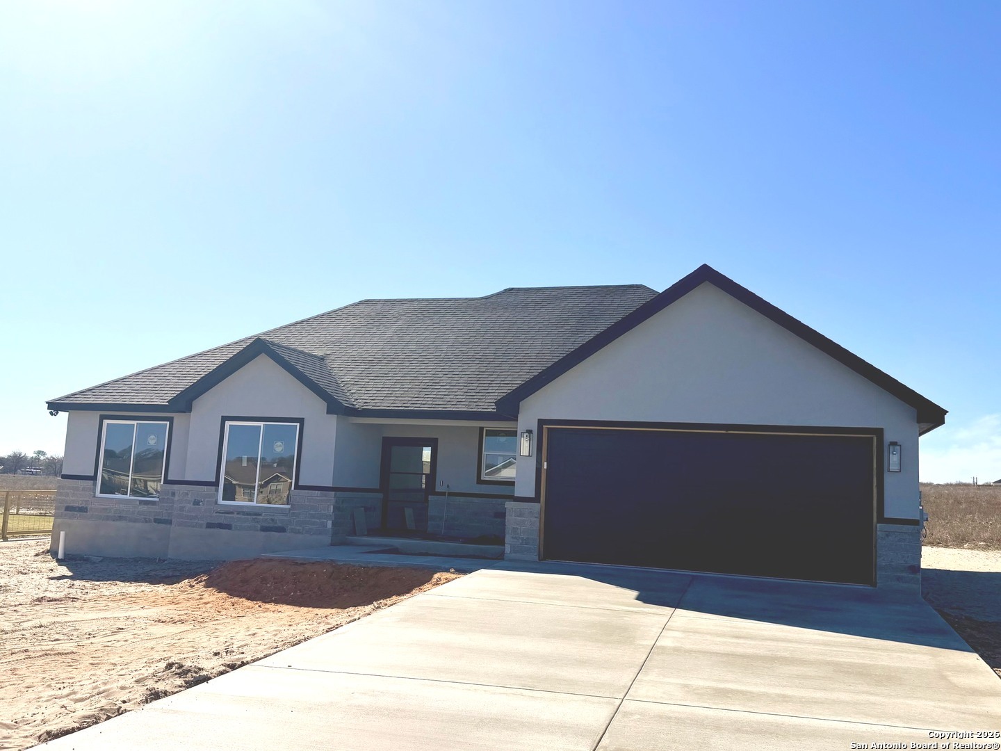 133 Merion Lane La Vernia, TX 78121 - Photo 2 of 18 a front view of a house with yard