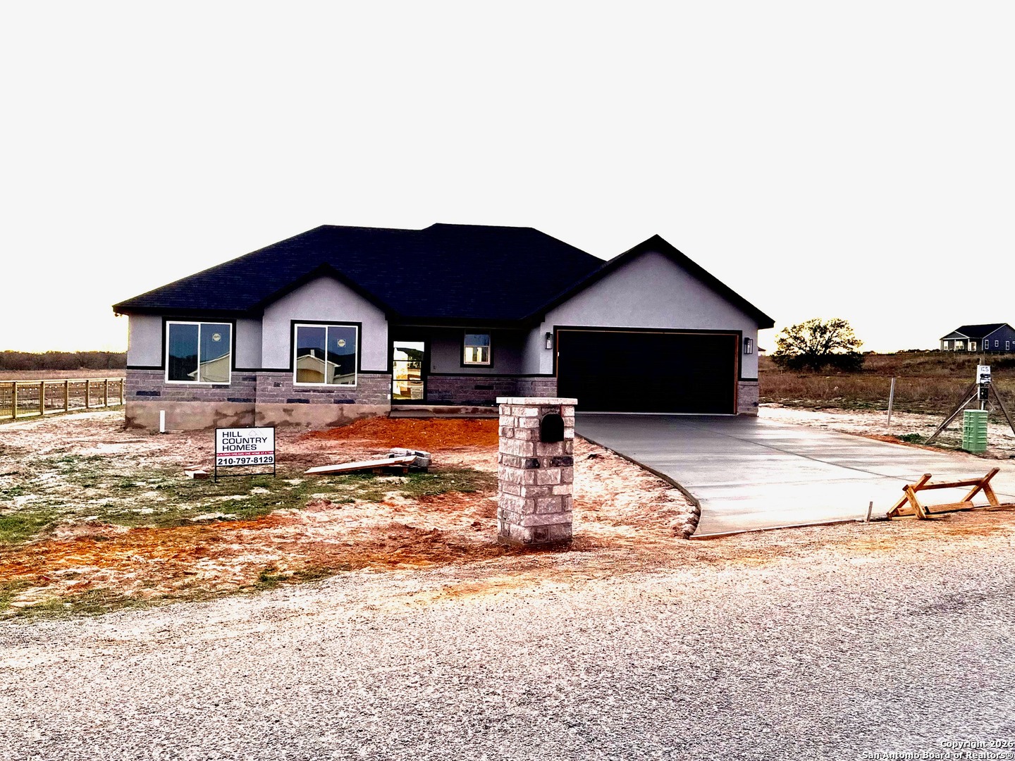 133 Merion Lane La Vernia, TX 78121 - Photo 10 of 18 a view of a house with a yard