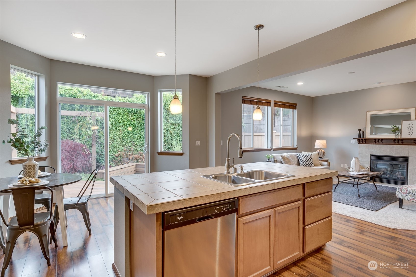 22917 42nd Drive Southeast Bothell, WA 98021 - Photo 5 of 36 a kitchen with a stove a sink a dining table and chairs