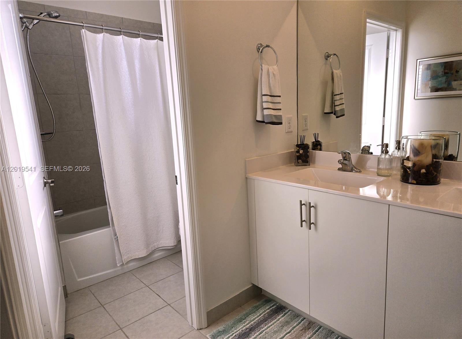 24400 Southwest 119th Place Homestead, FL 33032 - Photo 7 of 22 a bathroom with a sink a mirror a vanity and a shower
