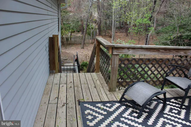 a view of balcony with wooden floor