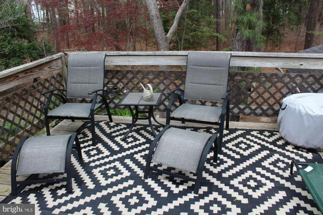 a view of a room with wooden floor and staircase