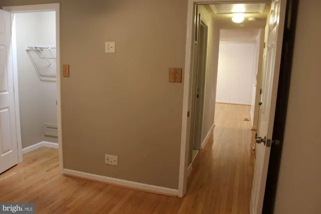 an empty room with wooden floor