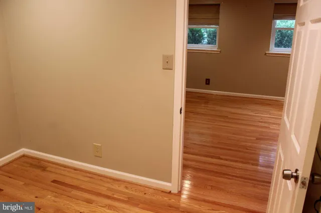 a view of staircase and wooden floor