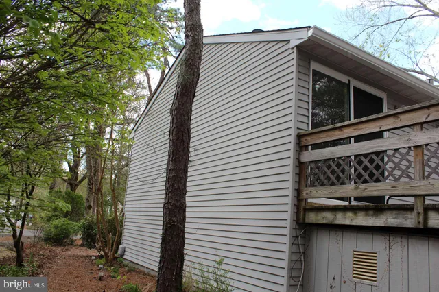 a view of a house with a side of the road