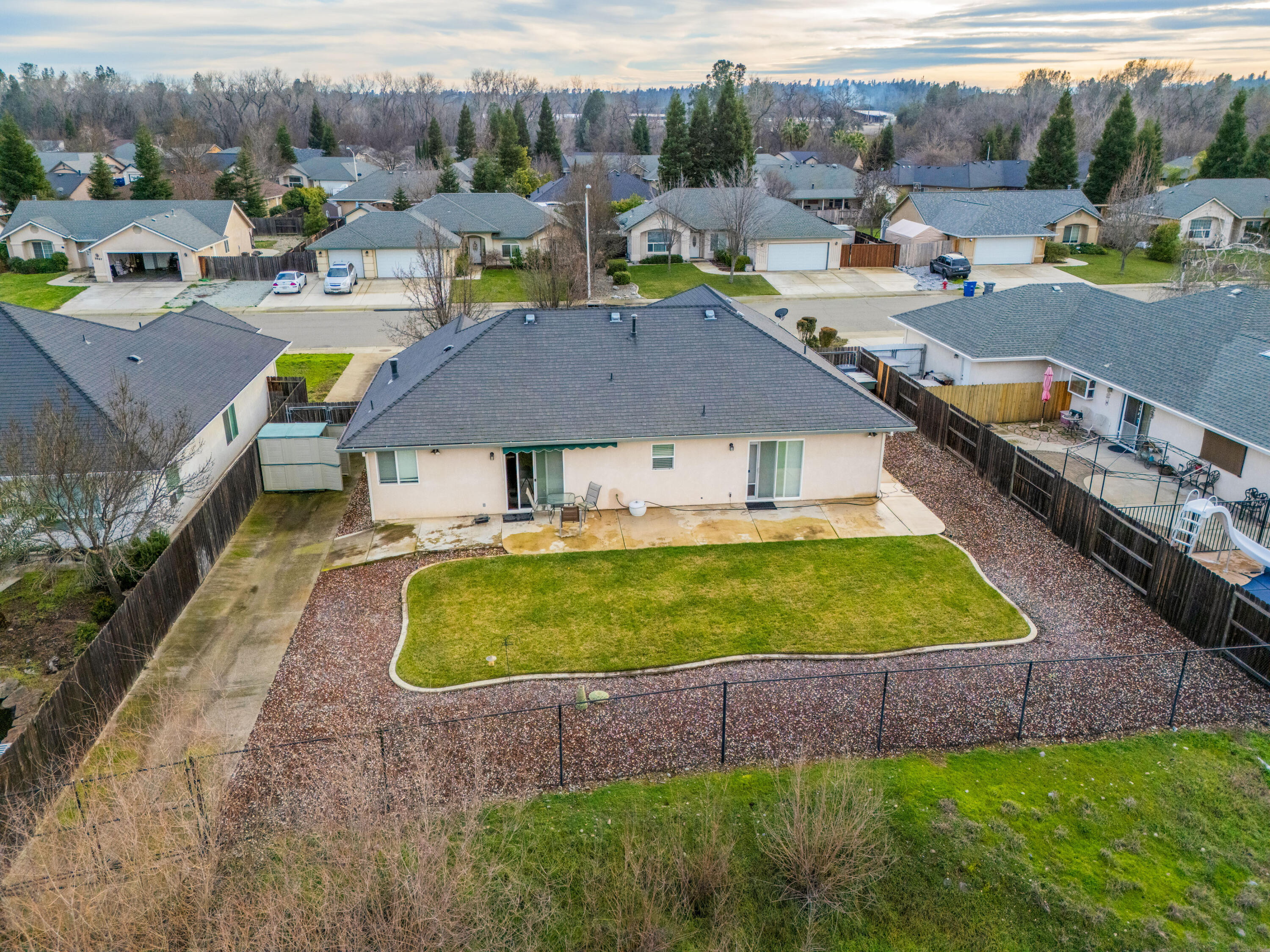 2662 Queens Way Redding, CA 96001 - Photo 18 of 21 a aerial view of a house with swimming pool and a garden