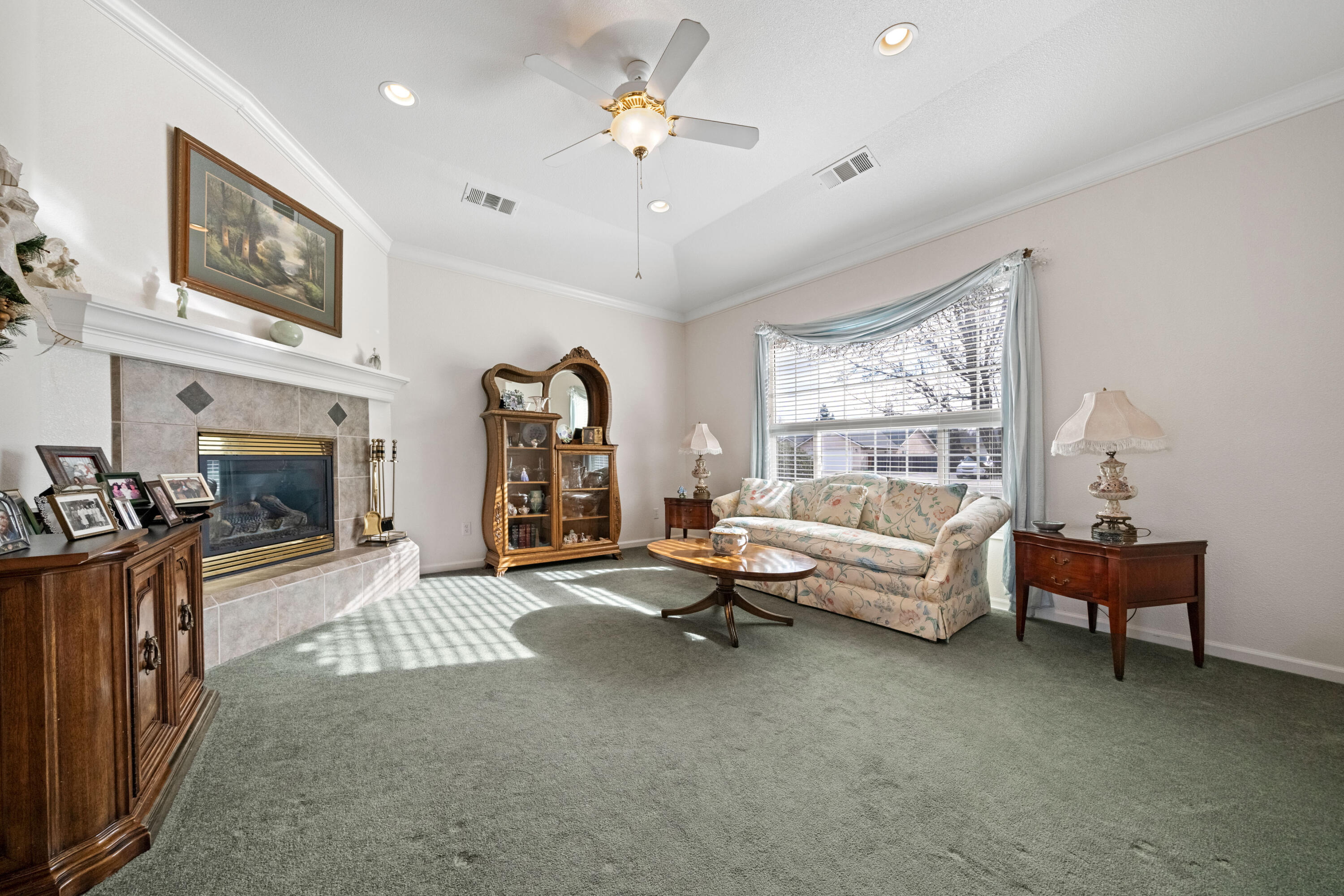 2662 Queens Way Redding, CA 96001 - Photo 6 of 21 a living room with furniture and a fireplace