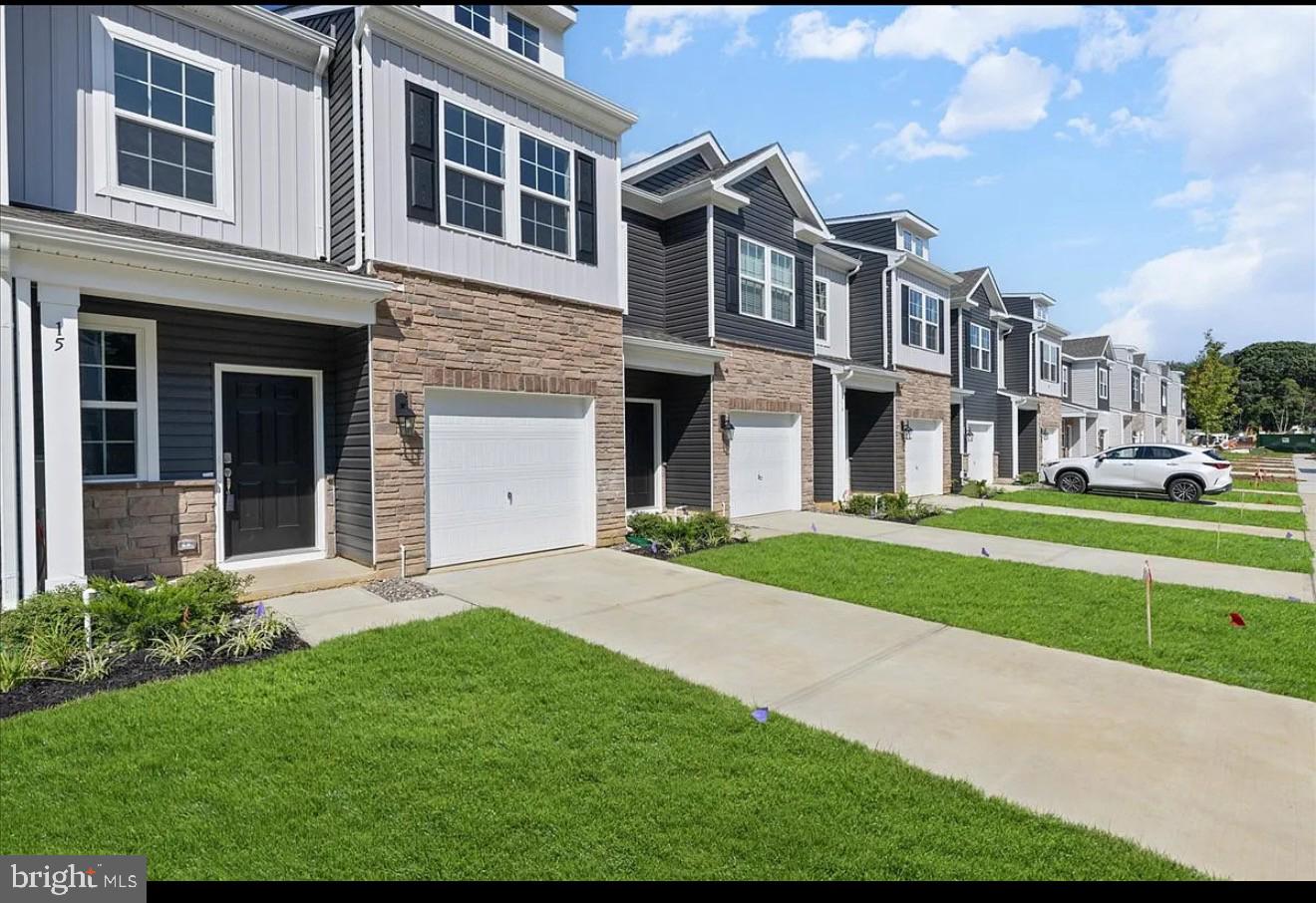 21 Whaler Drive Runnemede, NJ 08078 - Photo 3 of 20 a front view of a house with a yard and garage