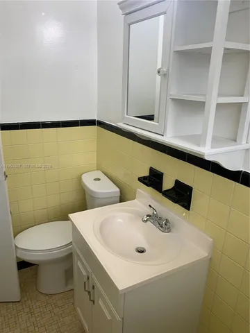 a view of a backyard with table and chairs