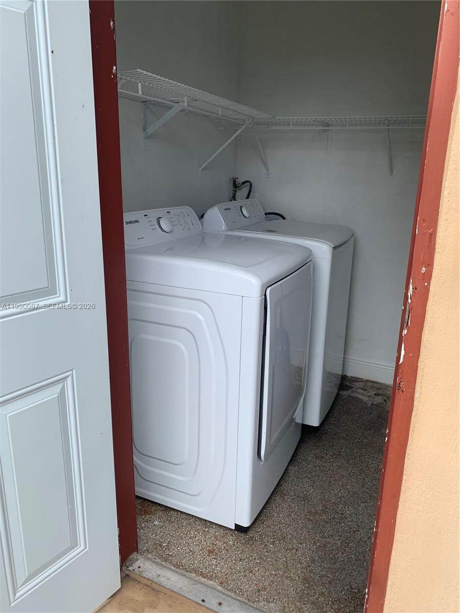 5616 Arthur Street, Unit NORTH Hollywood, FL 33021 - Photo 14 of 16 a utility room with dryer and washer