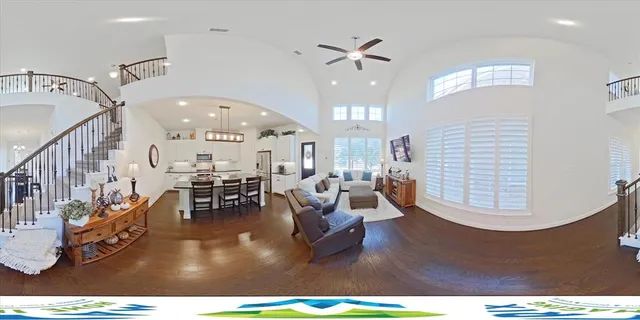 a living room with lots of dining room and wooden floor