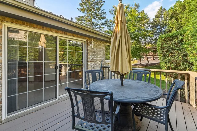 a view of a balcony with a table and chairs