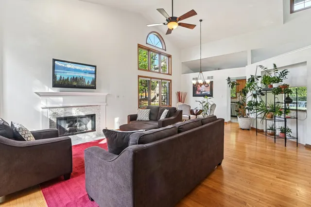 a living room with furniture fireplace and flat screen tv