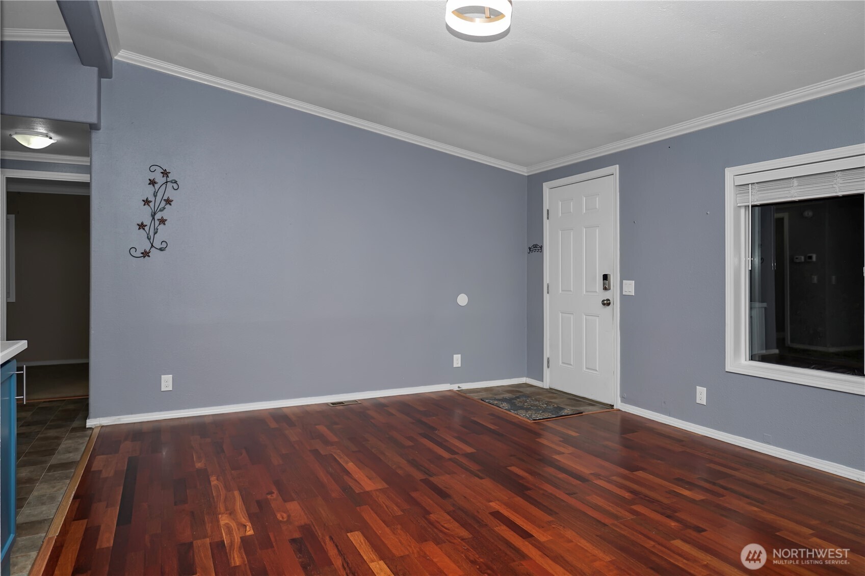 15253 Pine Drive Renton, WA 98058 - Photo 15 of 28 a view of an empty room with wooden floor and a window