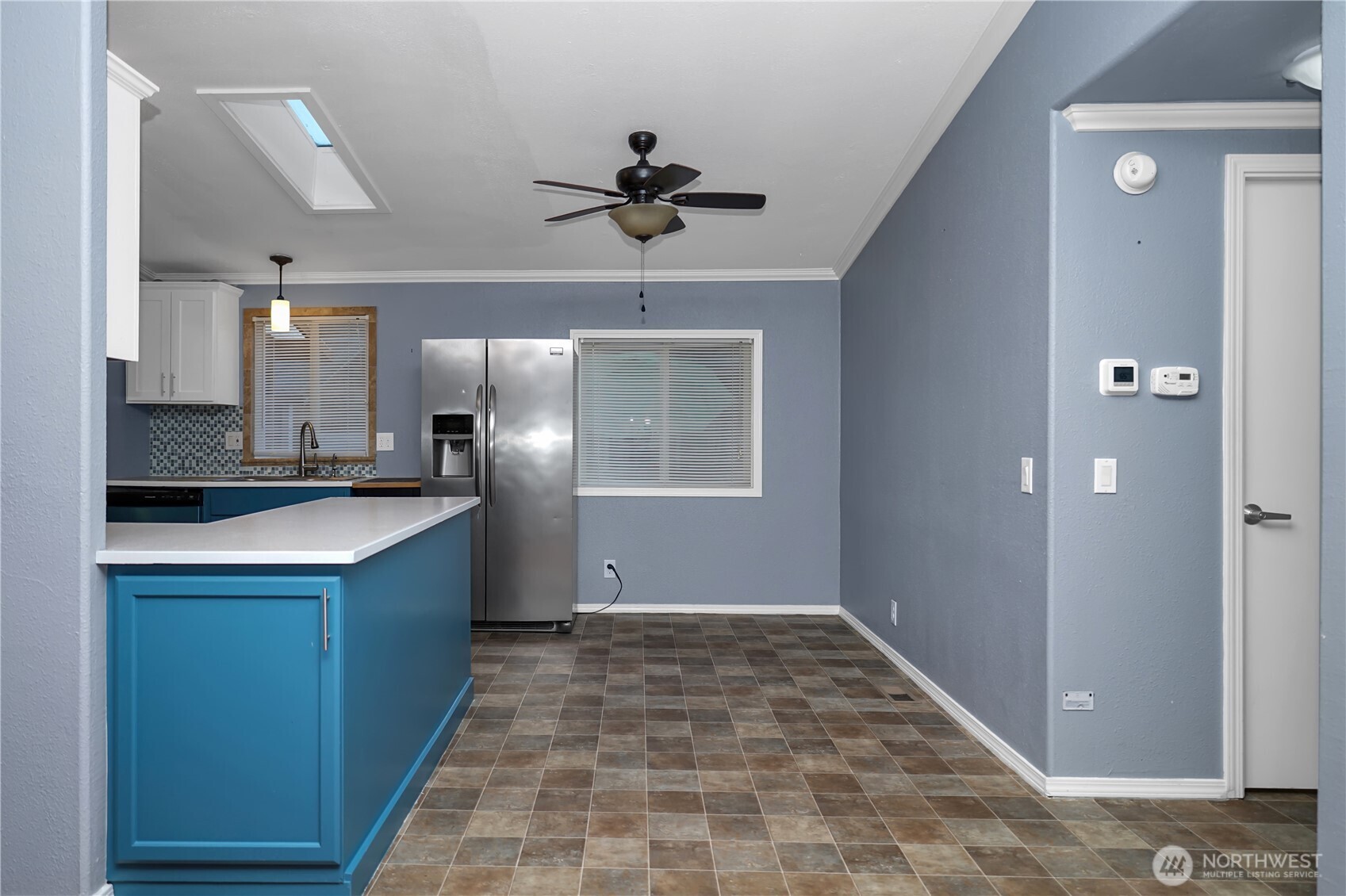 15253 Pine Drive Renton, WA 98058 - Photo 5 of 28 a view of a kitchen with a sink and a refrigerator