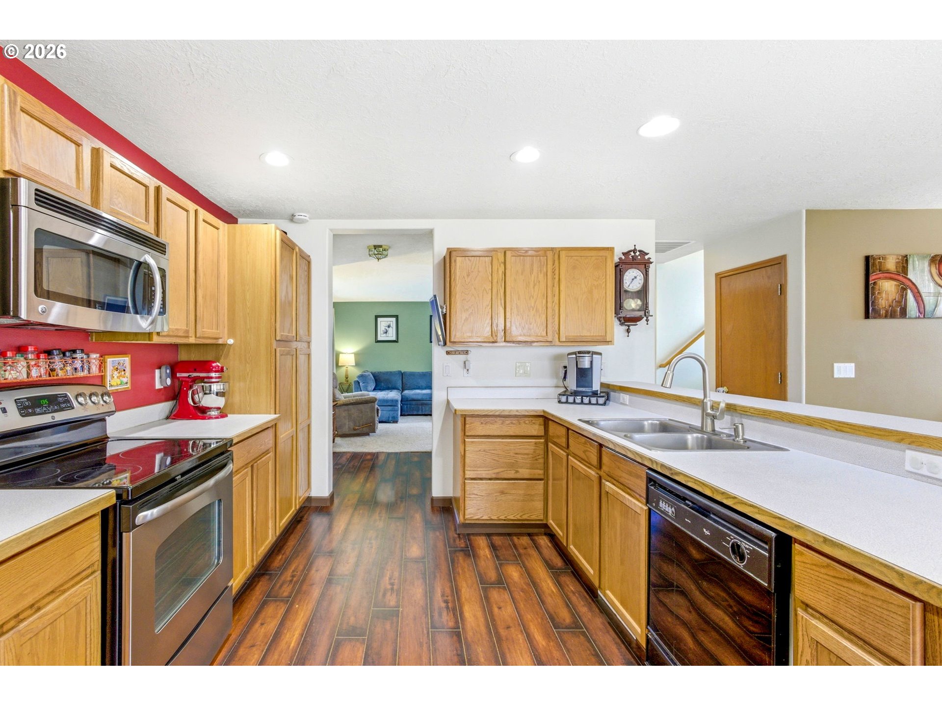 4820 Rebecca Street Northeast Salem, OR 97305 - Photo 13 of 30 a kitchen with stainless steel appliances granite countertop a sink stove and refrigerator