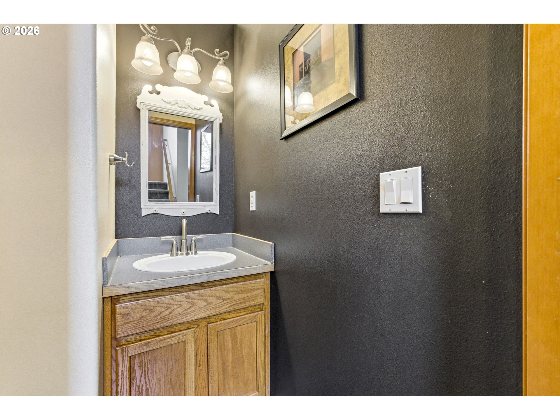 4820 Rebecca Street Northeast Salem, OR 97305 - Photo 14 of 30 a bathroom with a sink and a mirror