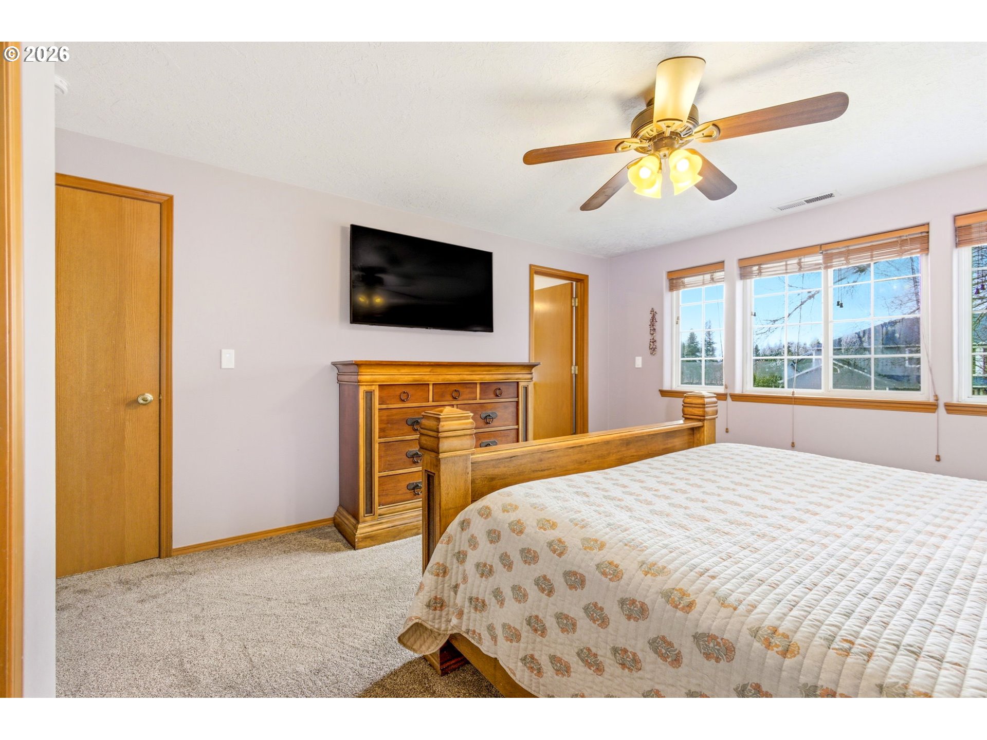 4820 Rebecca Street Northeast Salem, OR 97305 - Photo 16 of 30 a bedroom with a bed and a television