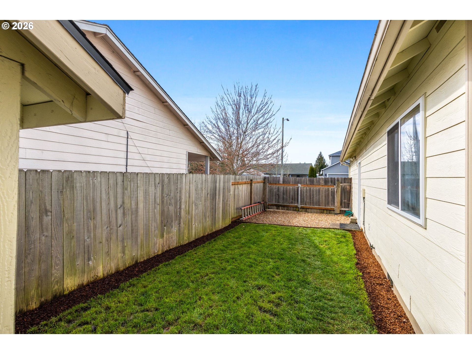 4820 Rebecca Street Northeast Salem, OR 97305 - Photo 30 of 30 a view of a backyard with wooden fence