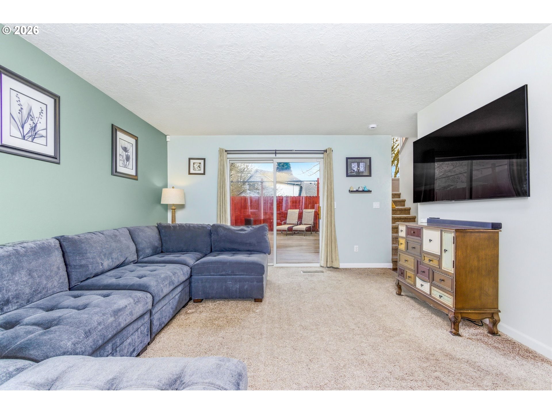 4820 Rebecca Street Northeast Salem, OR 97305 - Photo 8 of 30 a living room with furniture and a flat screen tv