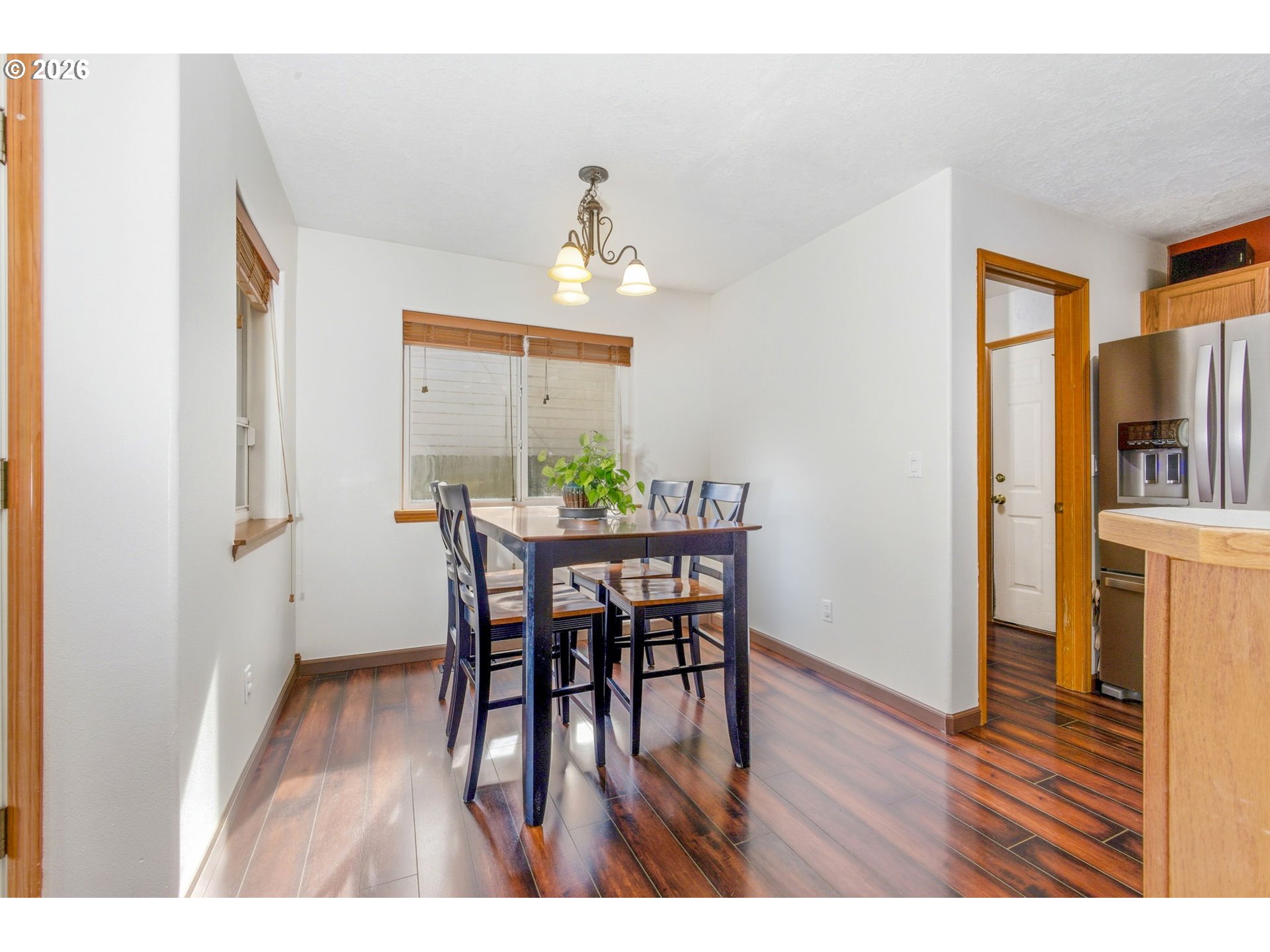 4820 Rebecca Street Northeast Salem, OR 97305 - Photo 9 of 30 a view of a dining room with furniture and wooden floor