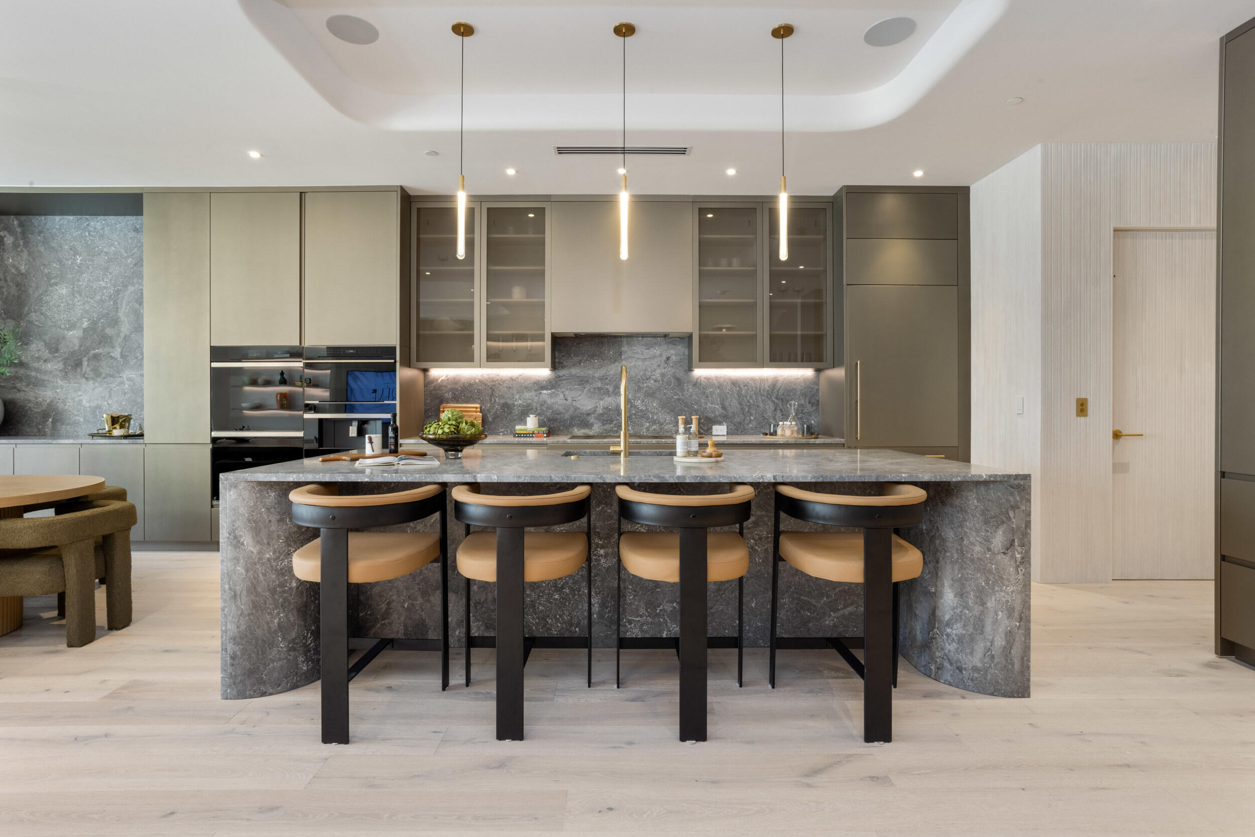 1252 George Bush Boulevard Delray Beach, FL 33483 - Photo 11 of 63 a kitchen with granite countertop a table chairs sink and stove