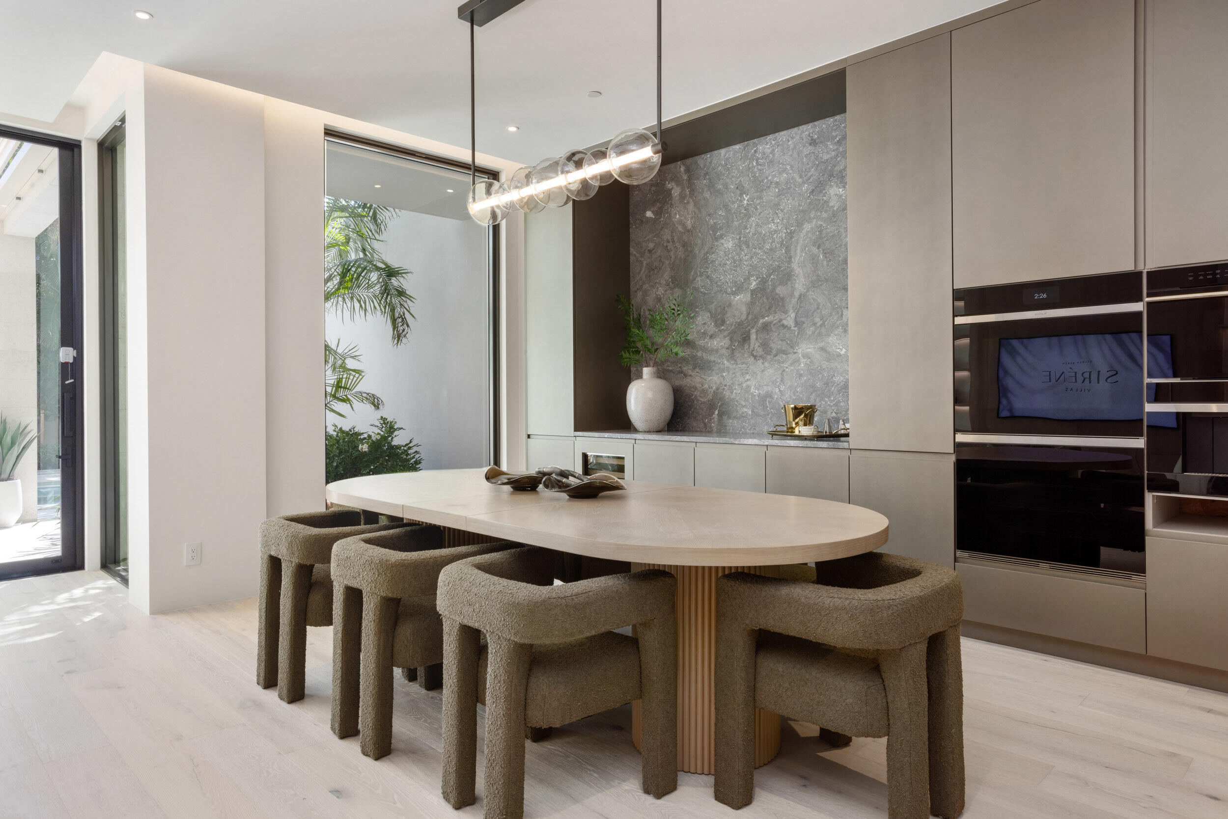 1252 George Bush Boulevard Delray Beach, FL 33483 - Photo 16 of 63 a view of a dining room with furniture window and wooden floor