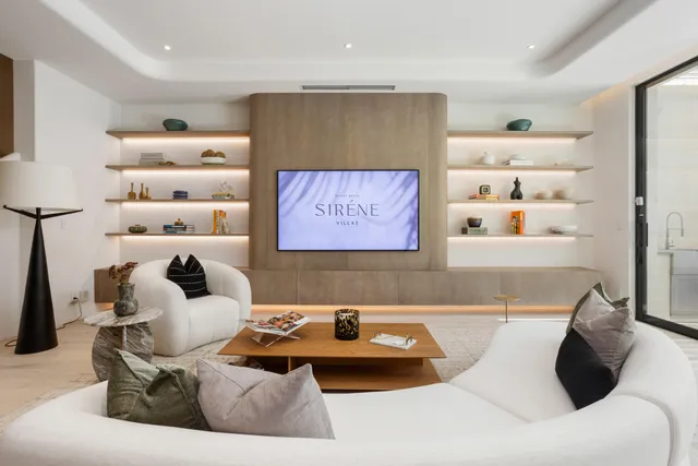 a view of a patio with table and chairs and potted plants