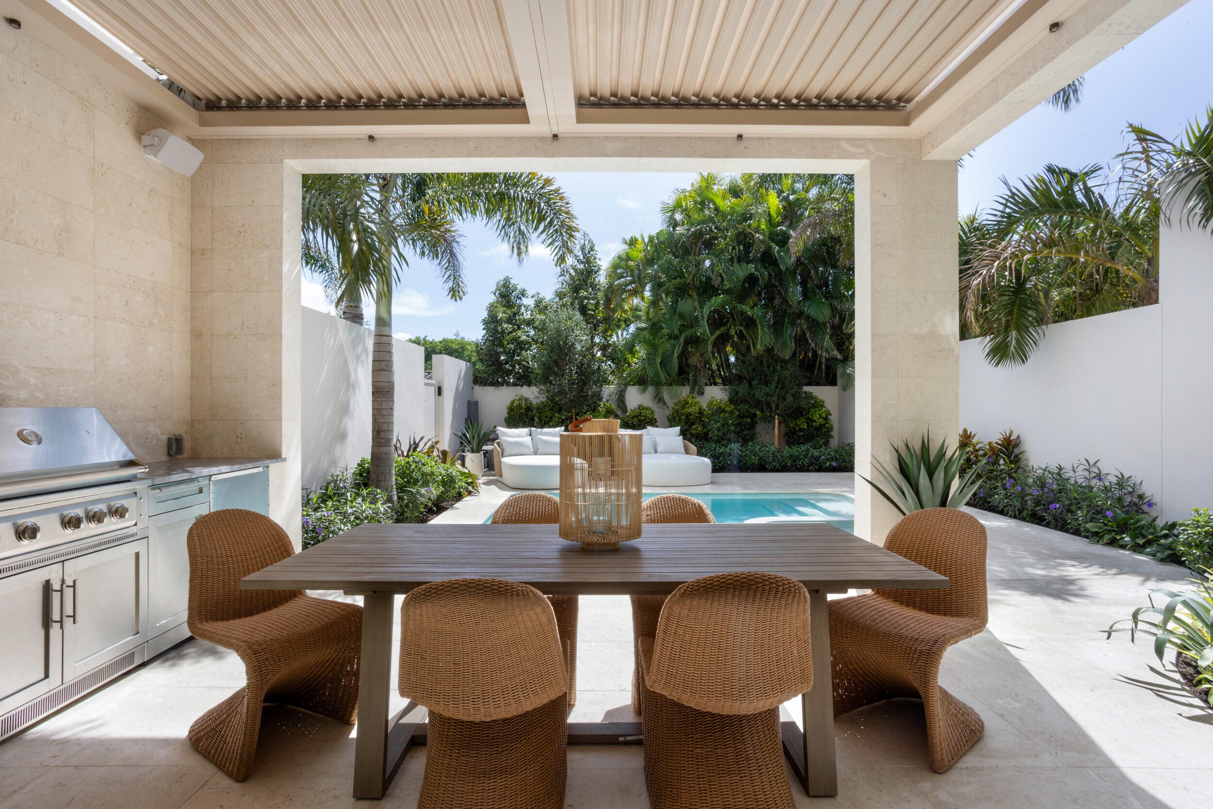 1252 George Bush Boulevard Delray Beach, FL 33483 - Photo 23 of 63 a view of a patio with table and chairs potted plants with wooden floor