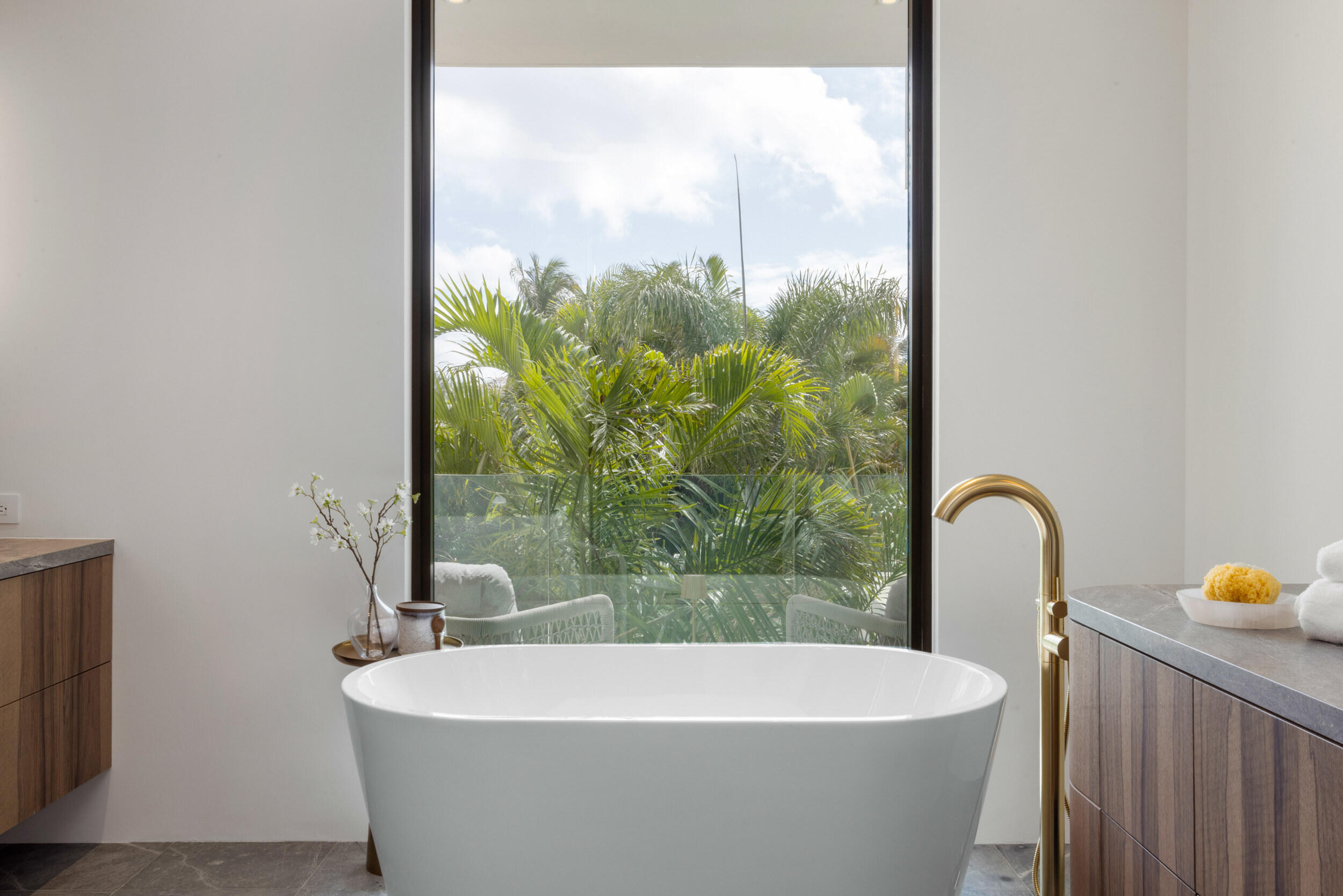 1252 George Bush Boulevard Delray Beach, FL 33483 - Photo 34 of 63 a white bath tub sitting in a bathroom next to a window