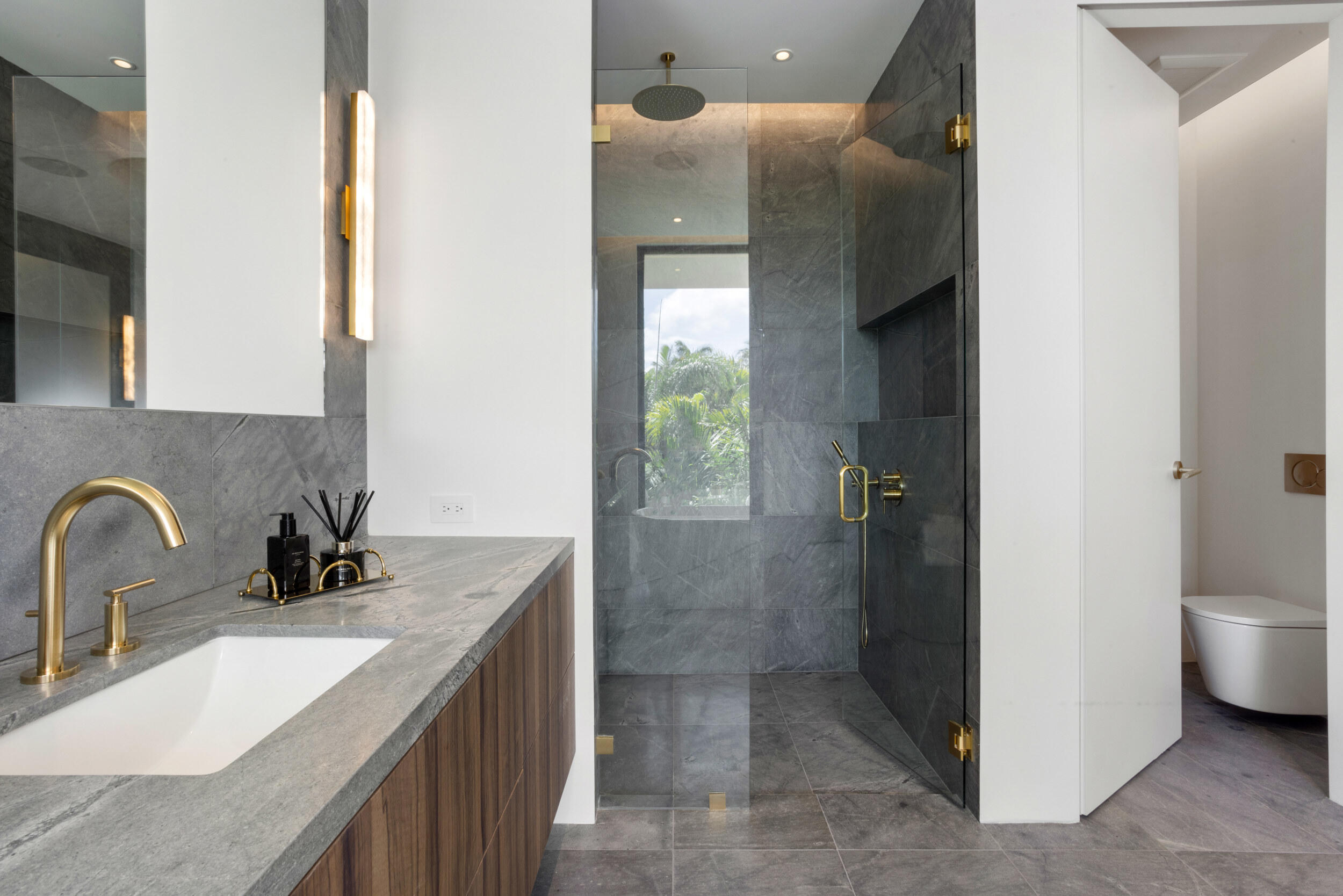 1252 George Bush Boulevard Delray Beach, FL 33483 - Photo 35 of 63 a bathroom with a sink and a mirror