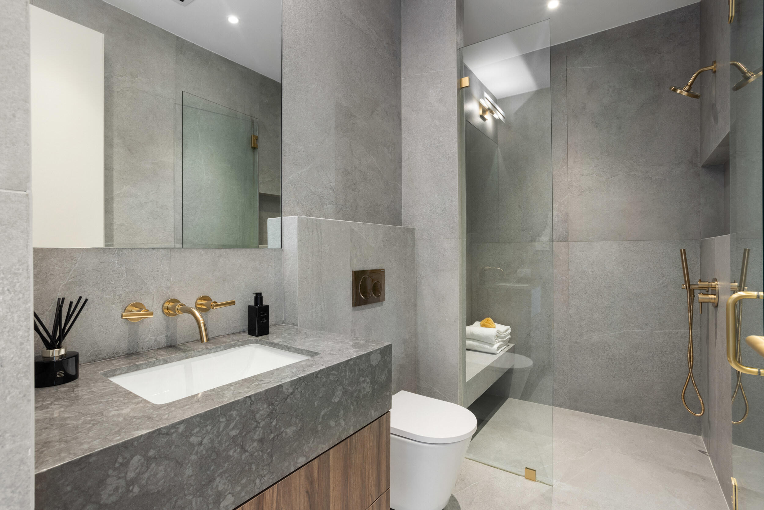 1252 George Bush Boulevard Delray Beach, FL 33483 - Photo 37 of 63 a bathroom with a granite countertop sink toilet and shower