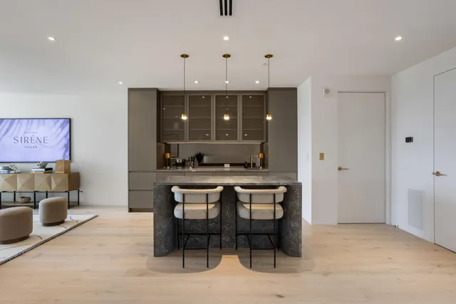 a view of a patio with furniture and floor to ceiling window
