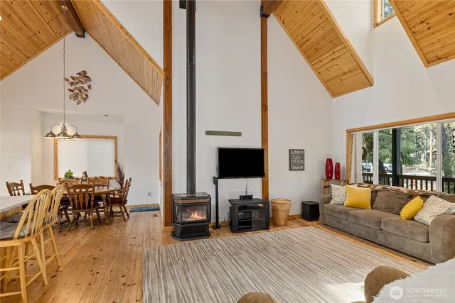 a kitchen with granite countertop a sink appliances cabinets and dining table