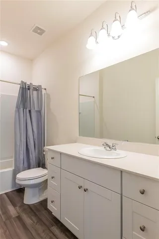 a kitchen with stainless steel appliances granite countertop a refrigerator stove and microwave