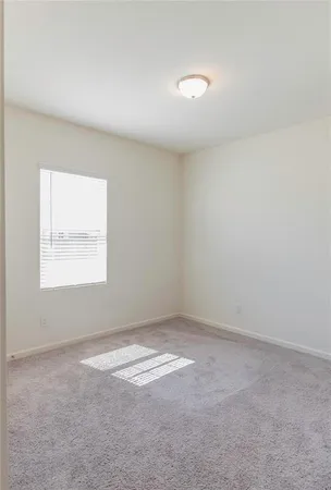 a bathroom with a granite countertop toilet a sink and a mirror