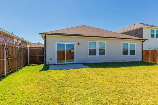 a view of a house with pool and yard