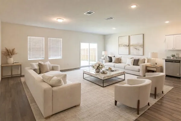 a living room with furniture and windows
