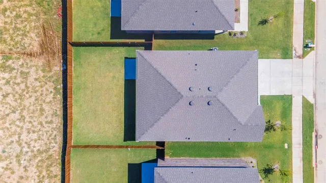 an aerial view of a house with a garden