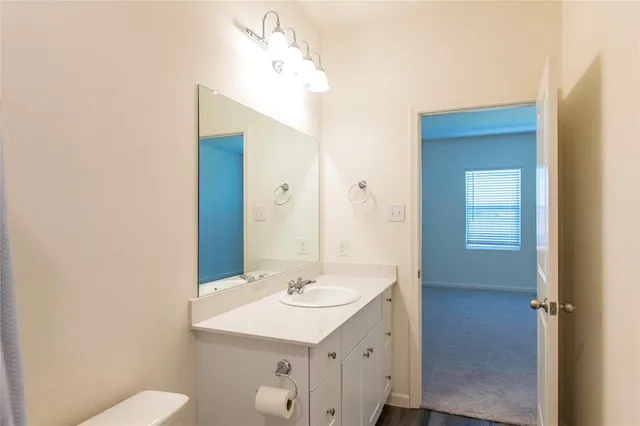 an empty room with closet and mirror