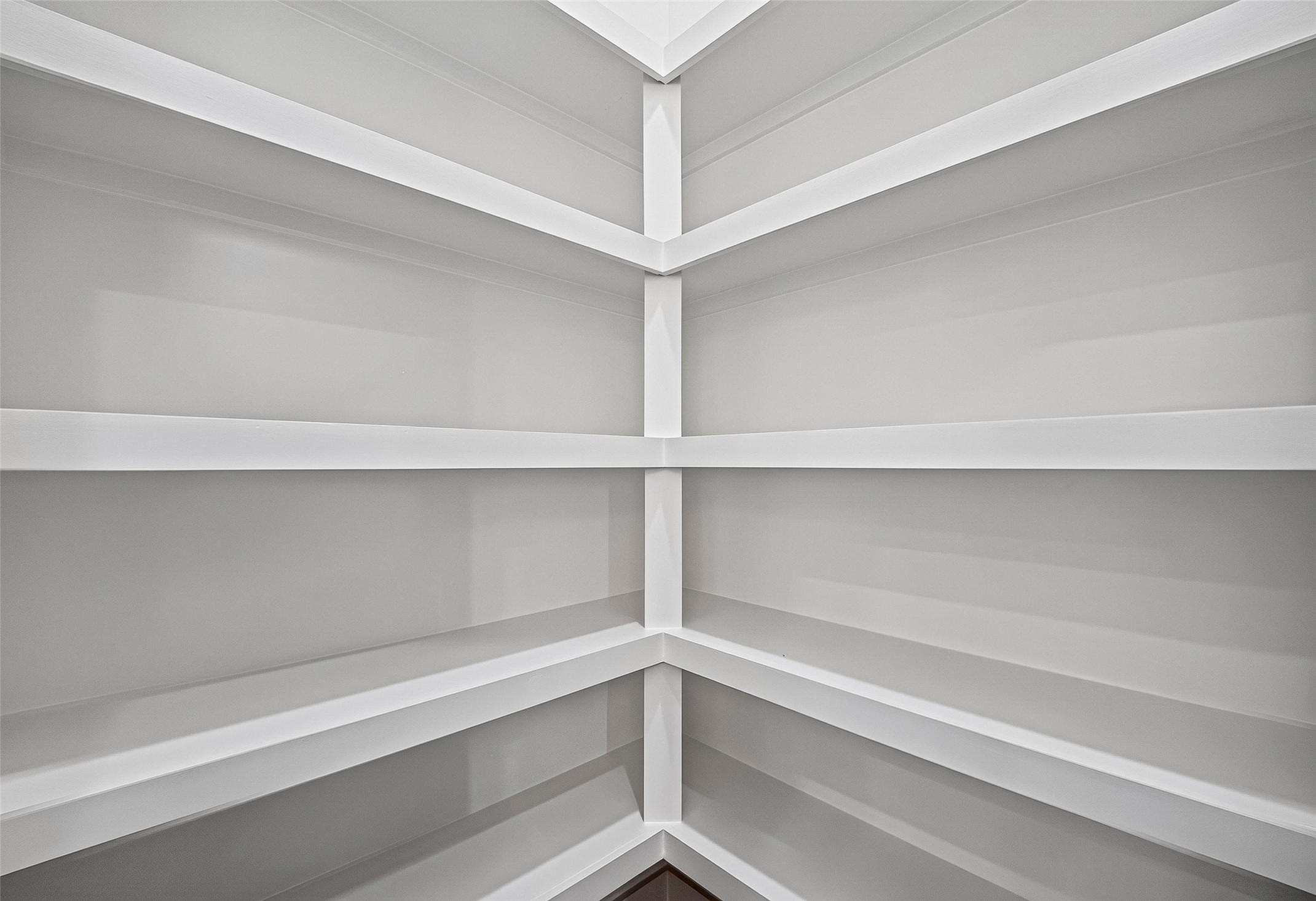 6747 Liverpool Street Houston, TX 77021 - Photo 12 of 38 Custom built-in corner shelving maximizes storage potential within a deeply recessed pantry closet.