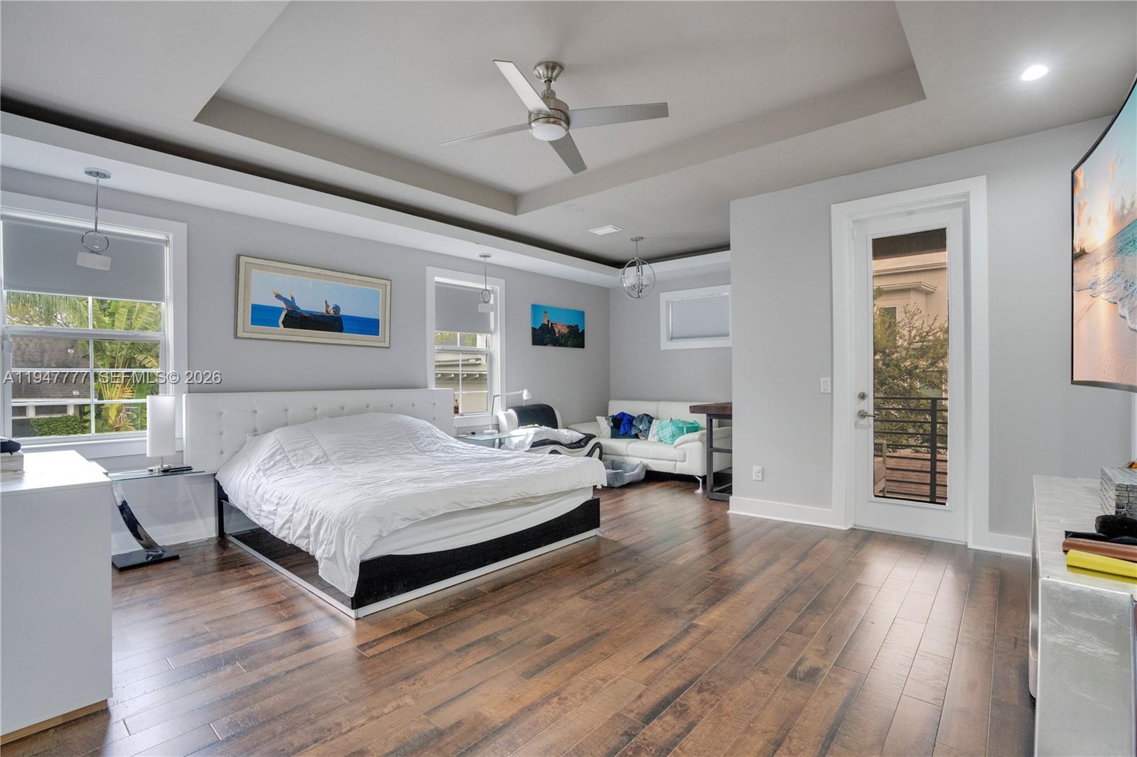 555 Peachtree Road Orlando, FL 32804 - Photo 13 of 35 a spacious bedroom with a bed and a table in it