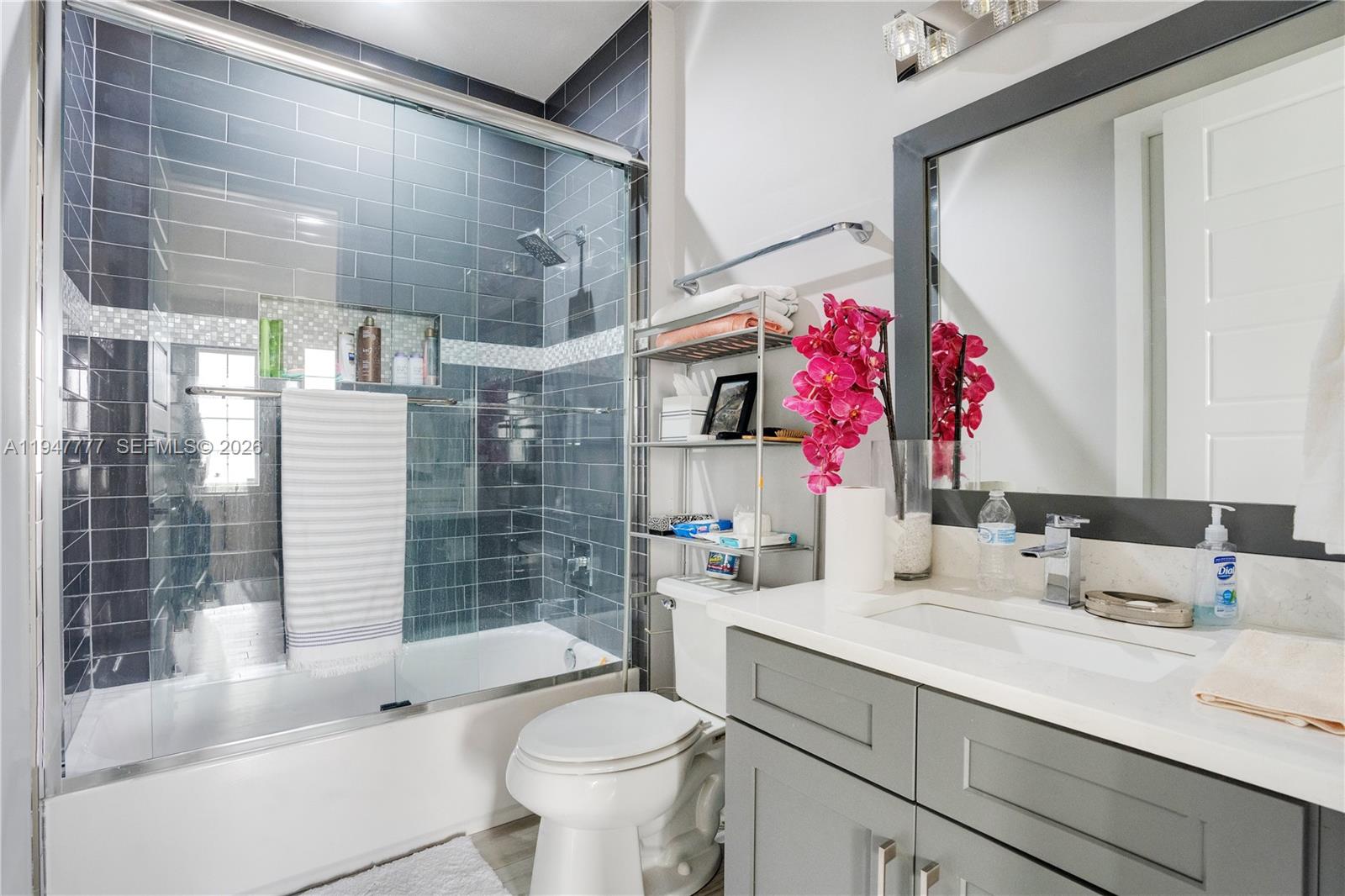 555 Peachtree Road Orlando, FL 32804 - Photo 14 of 35 a bathroom with a sink vanity mirror and toilet