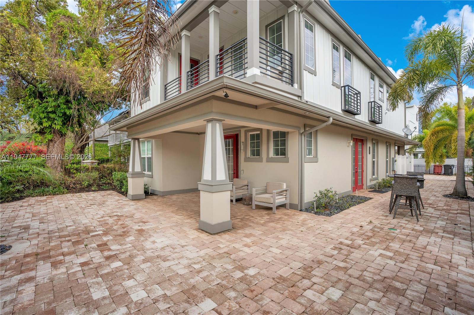 555 Peachtree Road Orlando, FL 32804 - Photo 2 of 35 a view of a building with a bench in patio