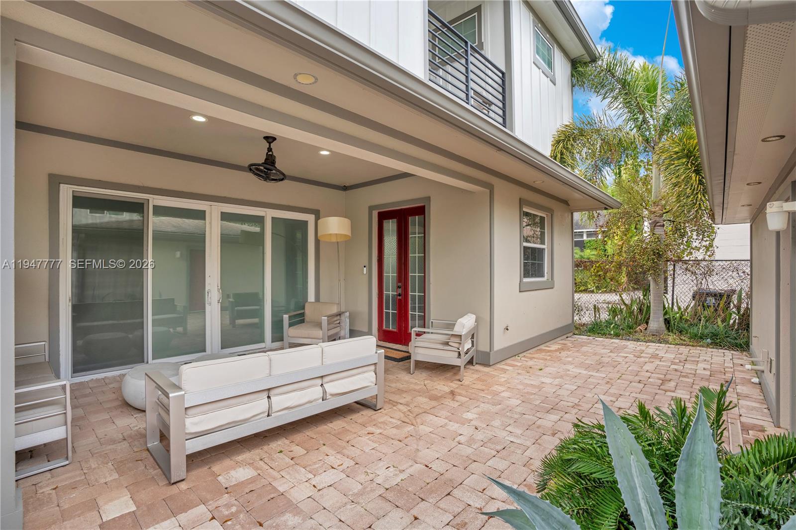 555 Peachtree Road Orlando, FL 32804 - Photo 22 of 35 a view of a patio with a table and chairs and potted plants